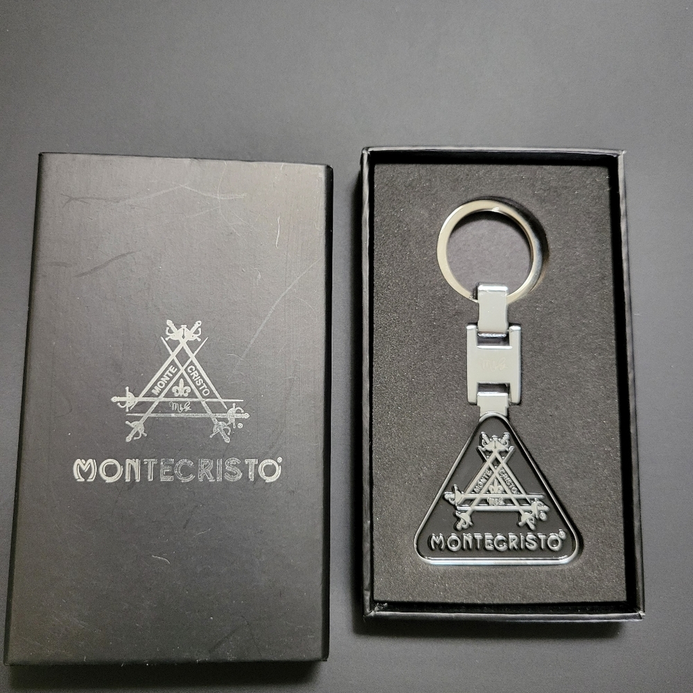 MONTECRISTO Key Chain, NWOT, black on faux silver, somewhat heavy.